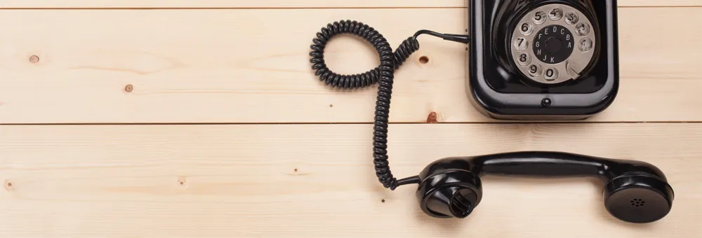 Old style telephone on a desk